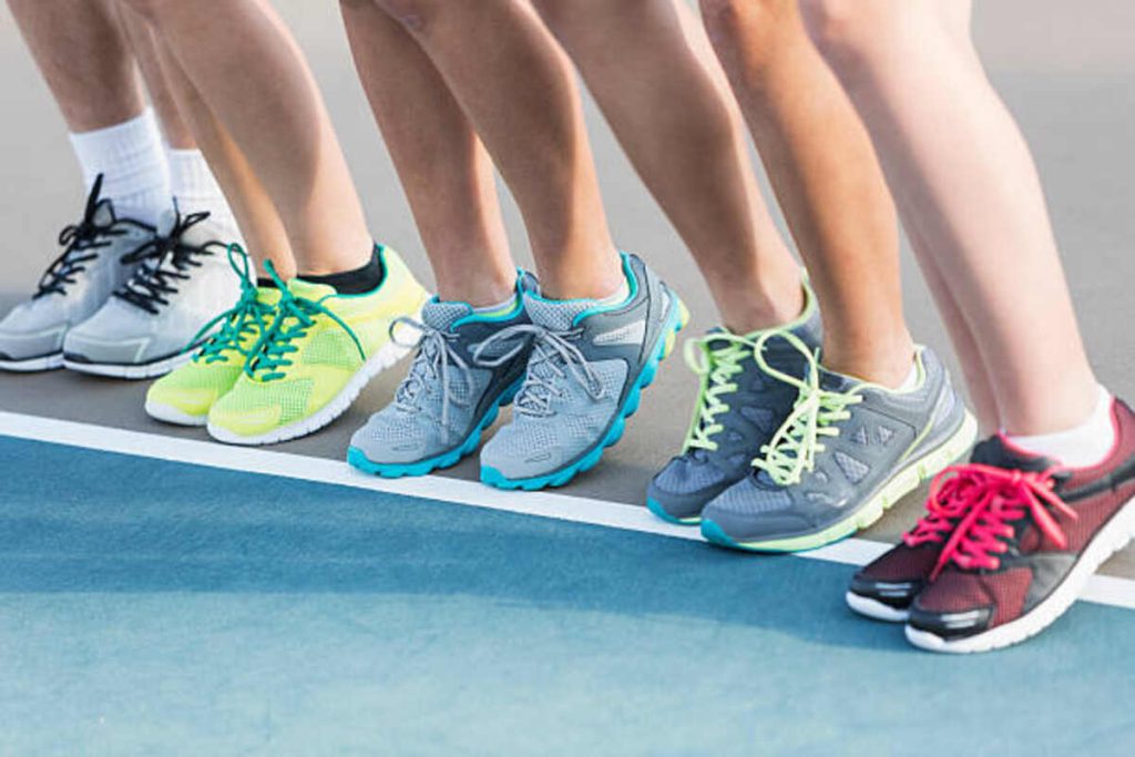 teenagers standing on tennis court
